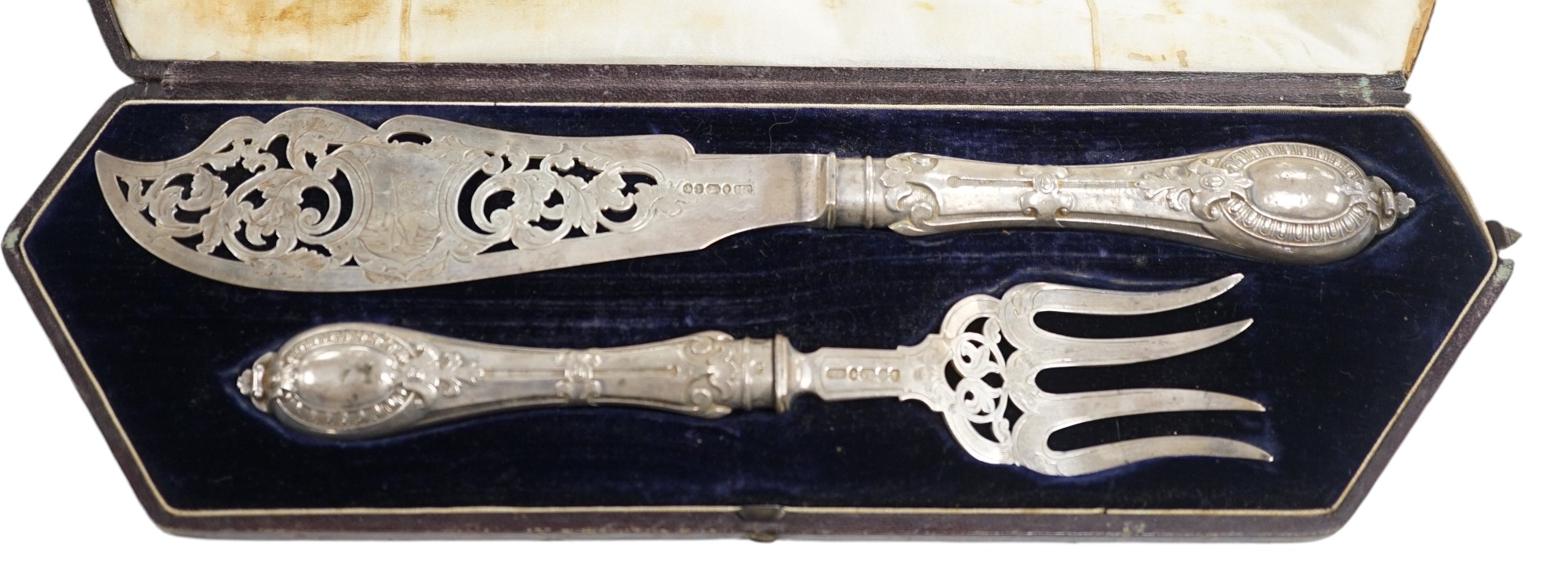 A cased pair of Victorian silver fish servers, Atkin Brothers, Sheffield, 1861, knife 32.4cm. Condition - poor to fair